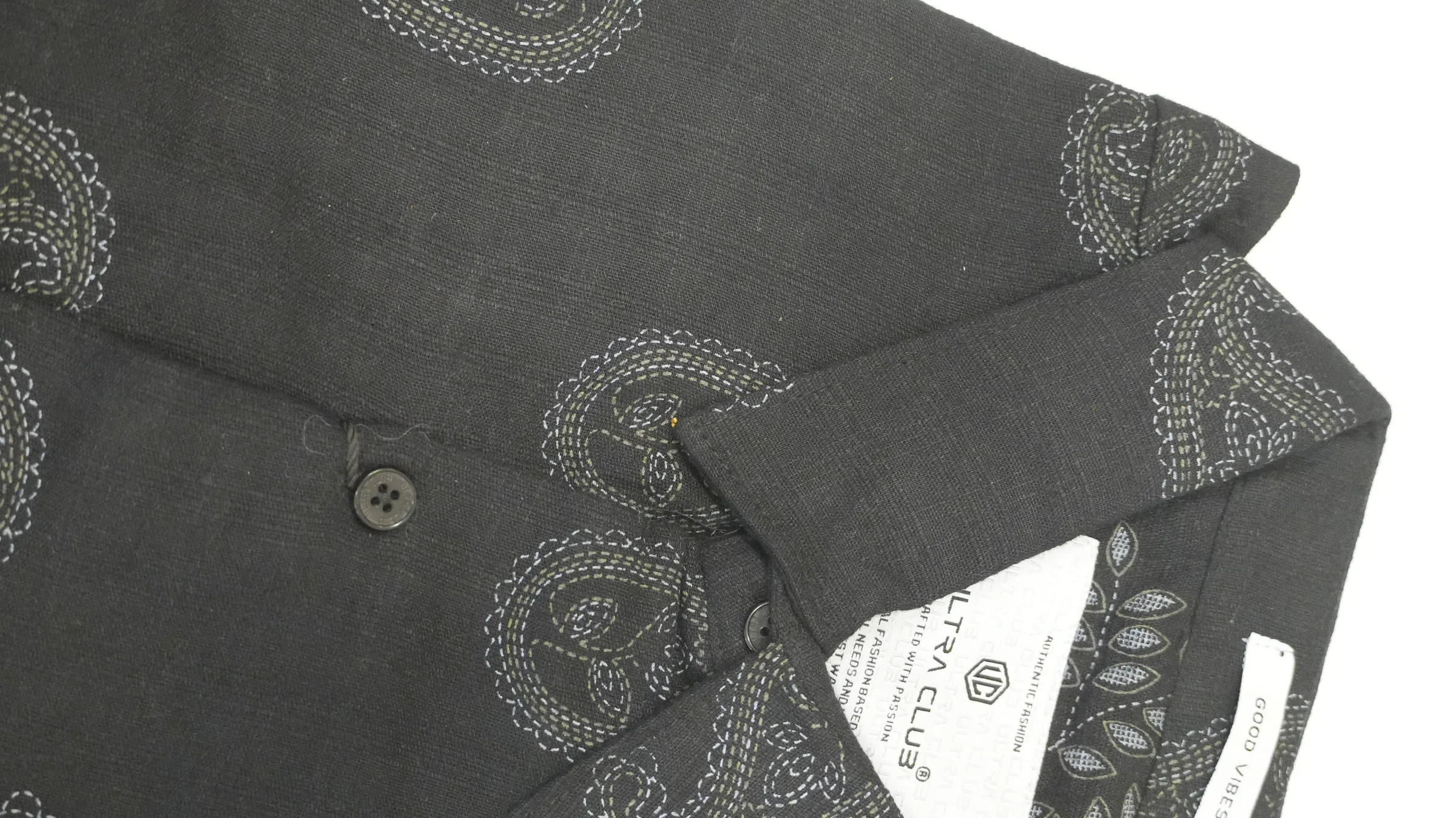 Charcoal linen shirt with ivory and olive paisley running-stitch embroidery