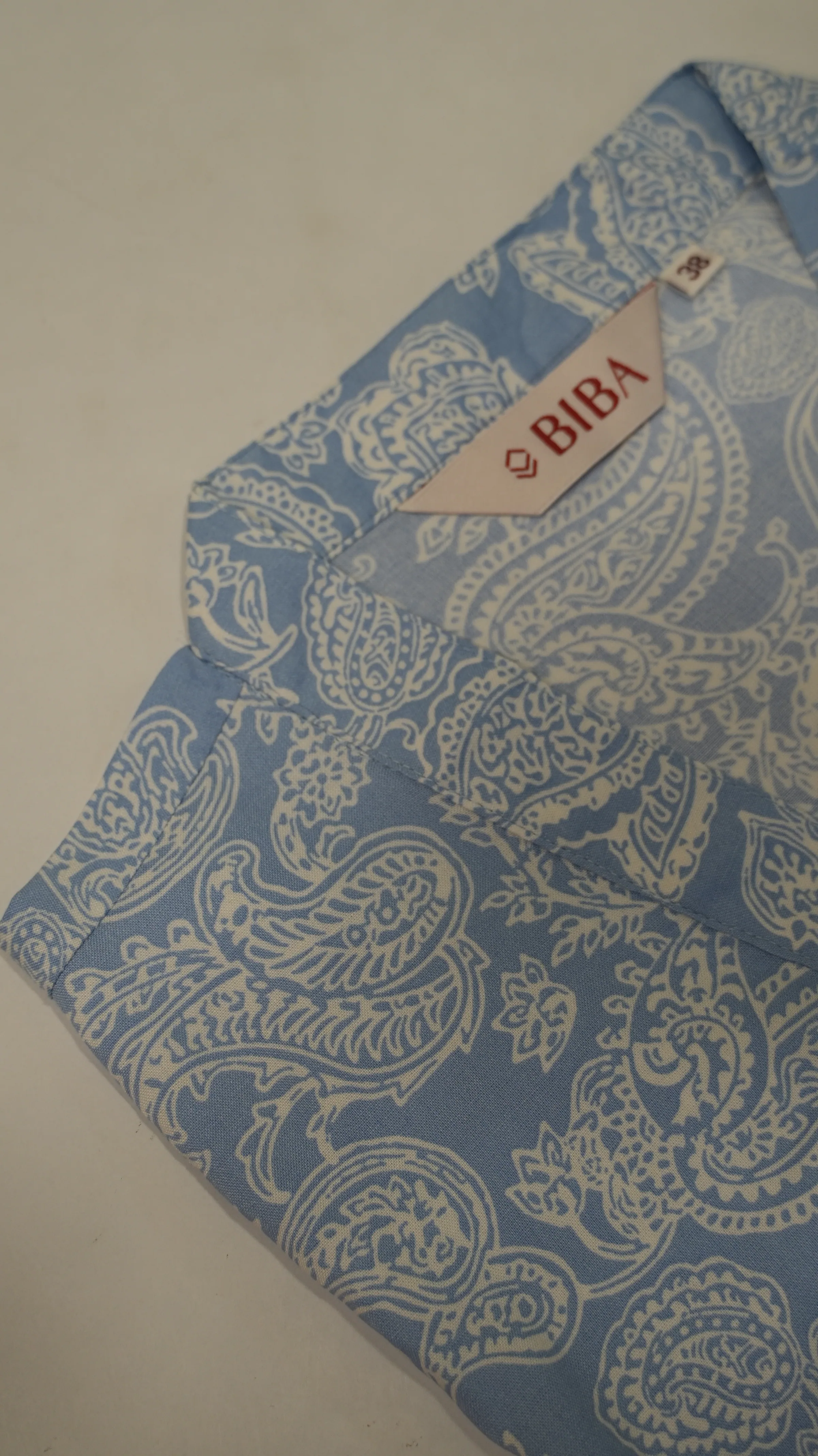 Cornflower blue cotton kurta with ivory paisley block print, collar detail